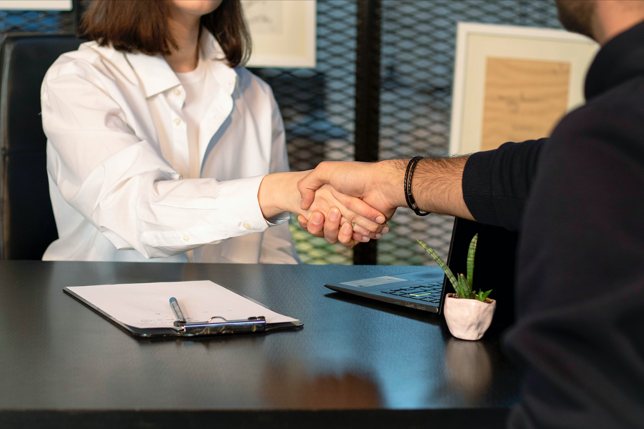 Man handshake with woman